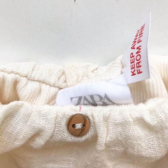 Zara NWT with flaws (small red pen mark) cream ribbed ruffle top 12-18 months - Picture 4 of 5